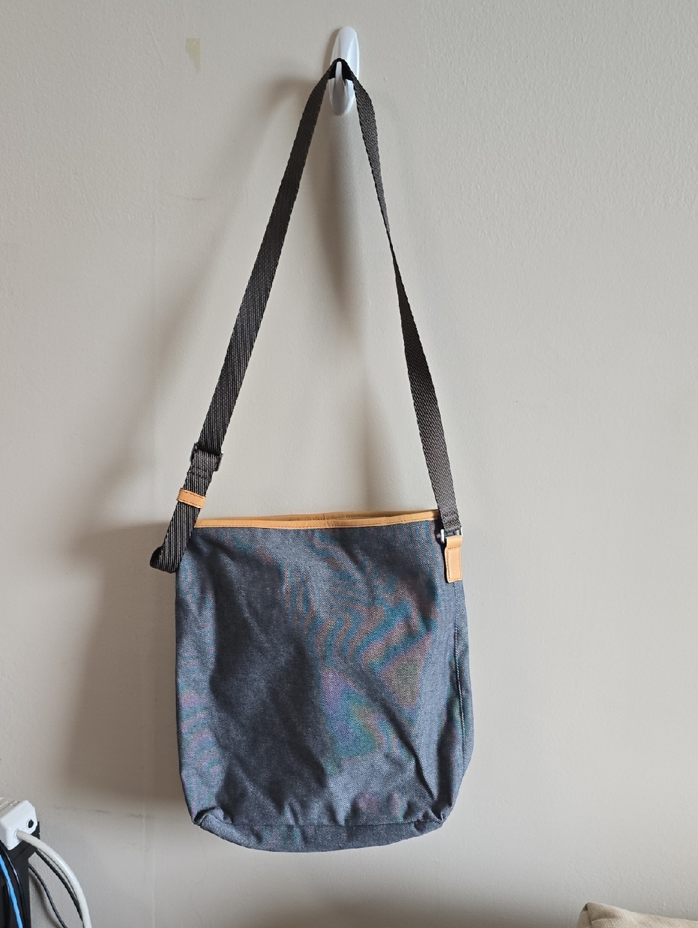Tumi Gray Interior Crossbody with Tan Leather Trim And Drawstring Closing
